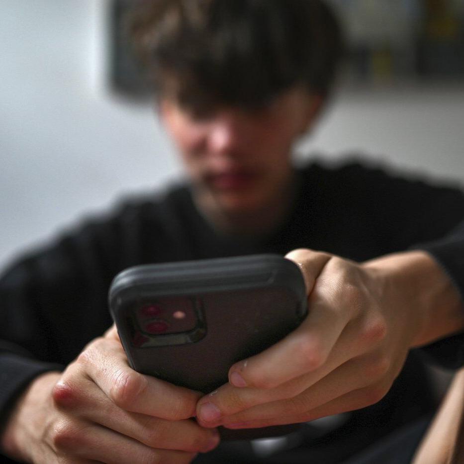 Australia won't force social media users to share their personal details when child ban takes effect